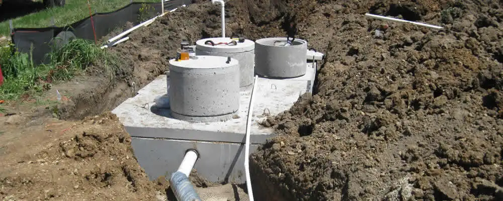 Septic system repair and installation site with tank access ports in Fort Lauderdale, FL